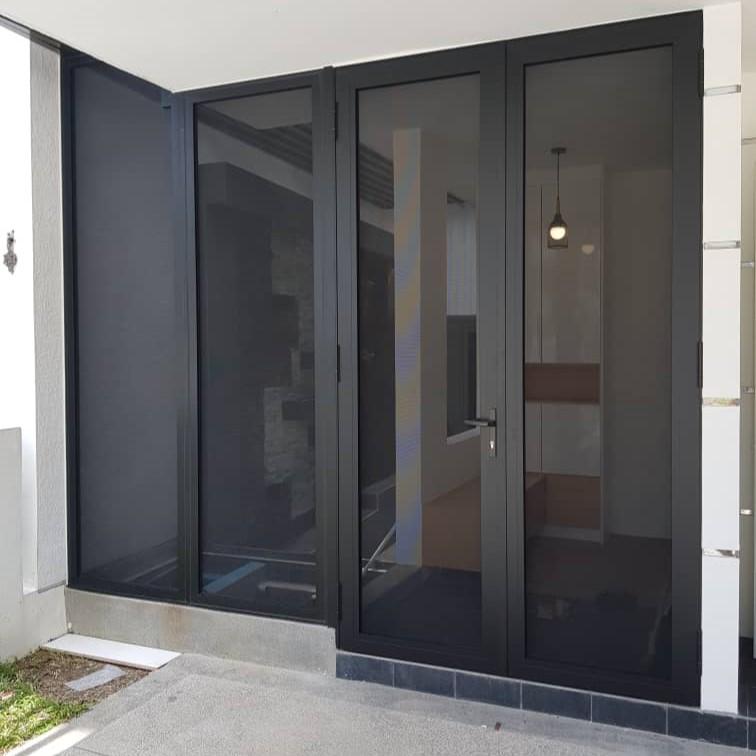 Dark-framed hinged security screen door with matching screened entrance panels
